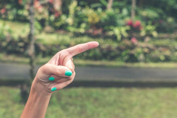 Close-Up Photography of a Hand Pointing