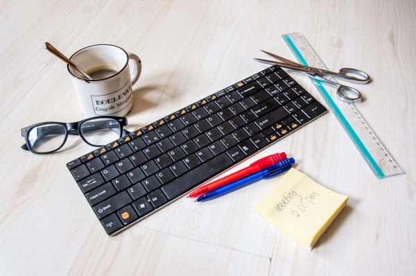 Coffee cup and office supplies