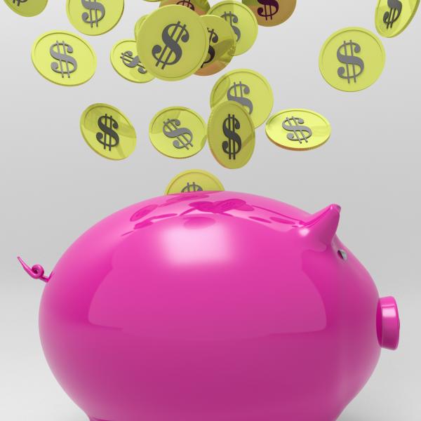 Coins Entering Piggybank Shows Money Saving
