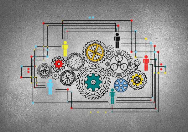 Concept of Work - A Person Drawing Cogwheels