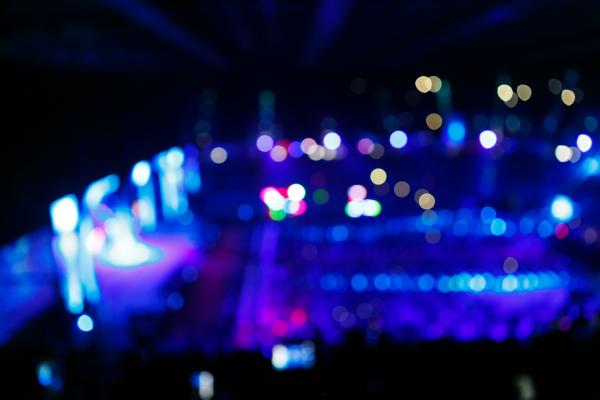 Concert crowd in front of bright stage