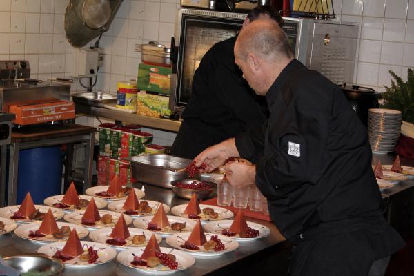 Cooks at work making desert