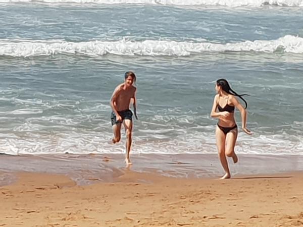 Couple running on the beach