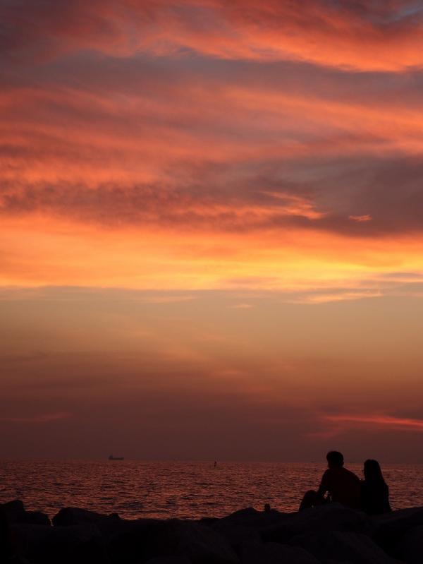 Couple Sit and Watch the Sunset