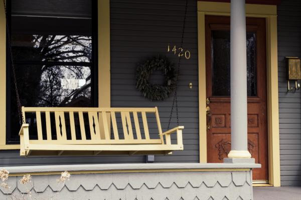 Cozy house veranda with swing