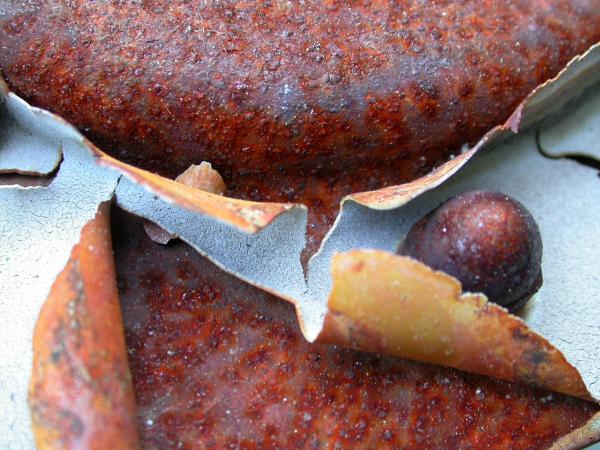Cracked painting on rusted metal