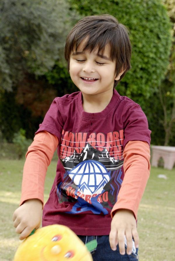 Cute Kid Playing in the Lawn