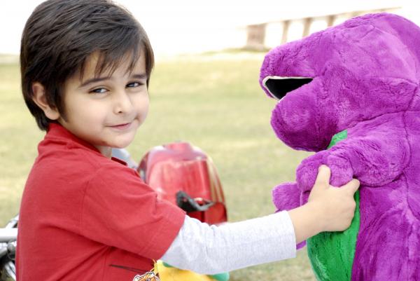 Cute Kid Playing with Dino