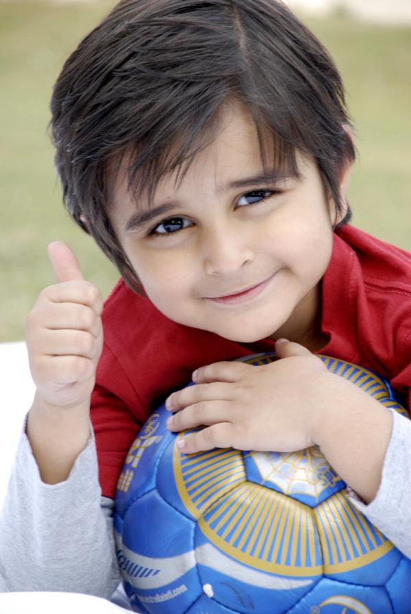 Cute Kid Showing Thumbs Up