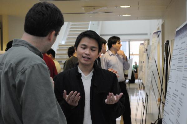 David Wagner reviewing research poster closeup 2