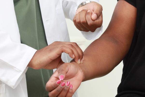 Doctor measuring pulse
