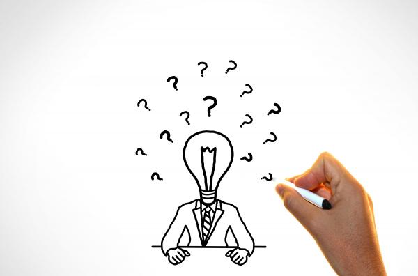 Doubts and ideas concept - Businessman with questions marks
