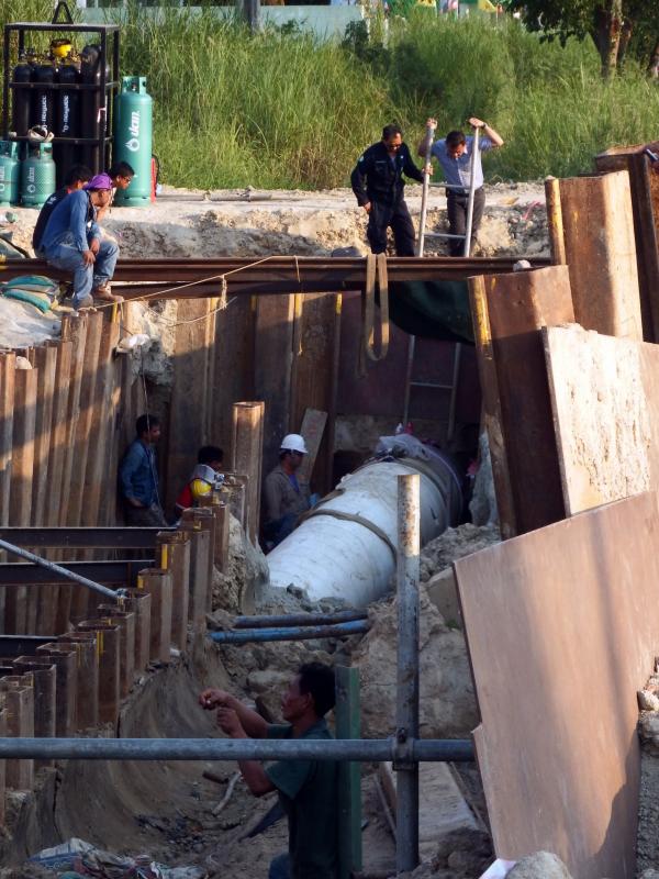 Engineers work on a pipeline