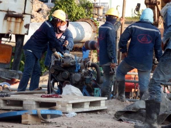 Engineers work on a pipeline