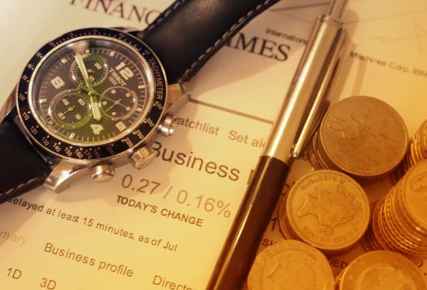 Euros and British Pounds - Finance Concept with Watch - Brexit