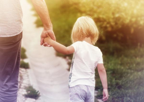 Father Holding Hands with Little Daughter
