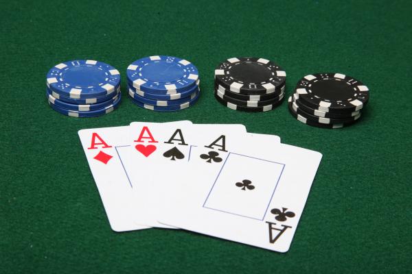 Four of a kind aces with poker chips