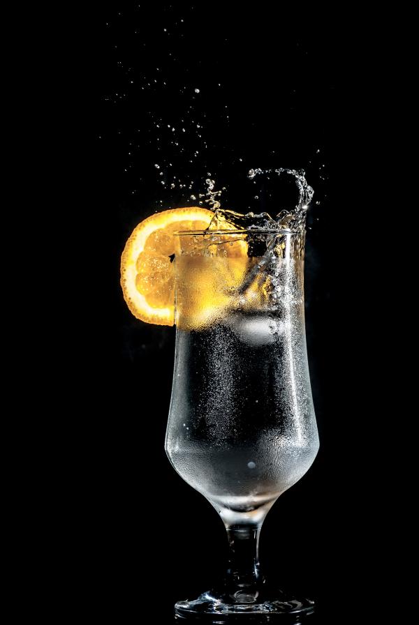 Full Wine Glass With Lemon Slices