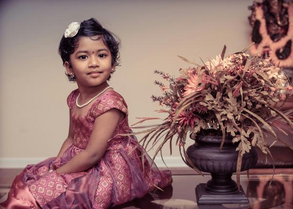 Girl Beside Flower Vase Inside White Painted Room