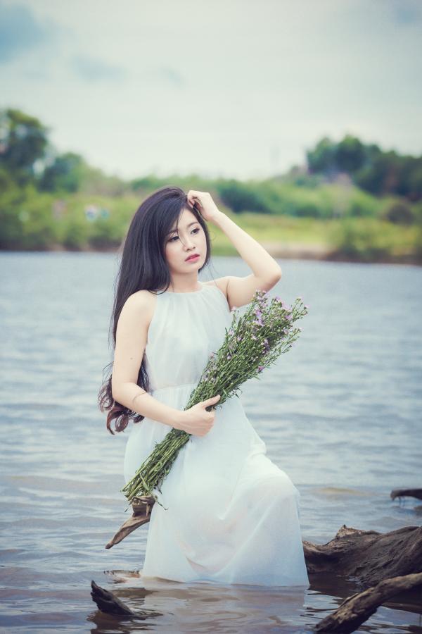Girl in water with tunic