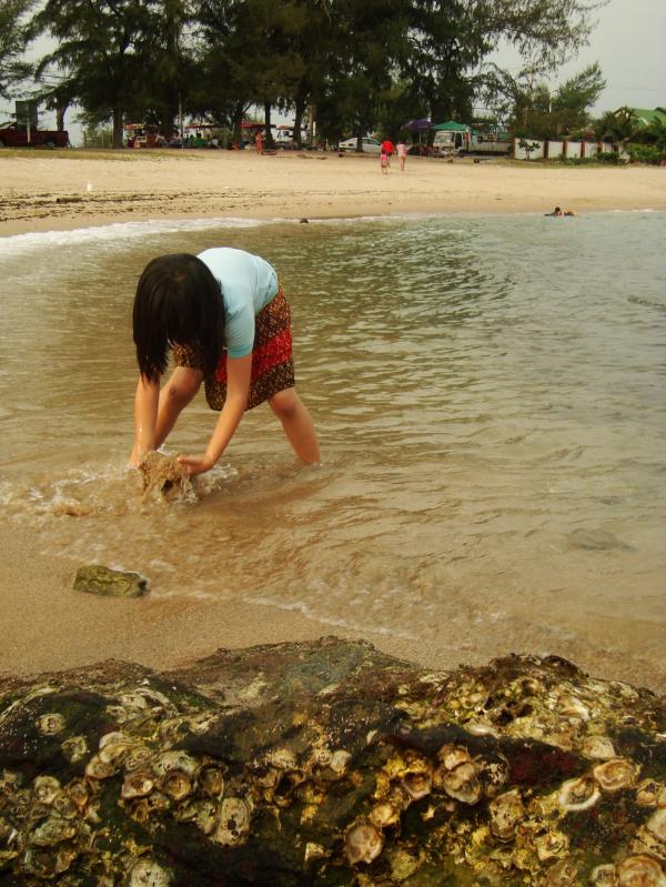 Girl playing on the beach