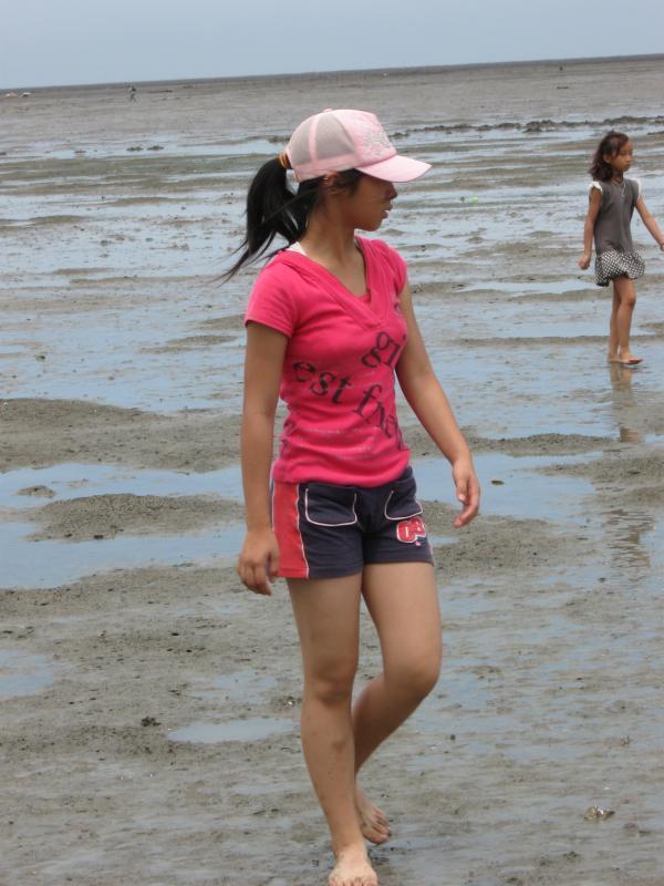 Girl Wading Through Mud