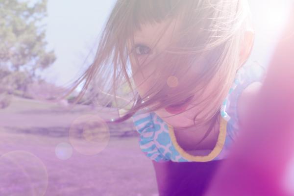 Girl's in Yellow and Blue Floral Shirt Taking Photo