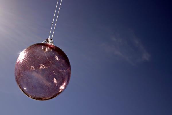 Glass ball against the sky