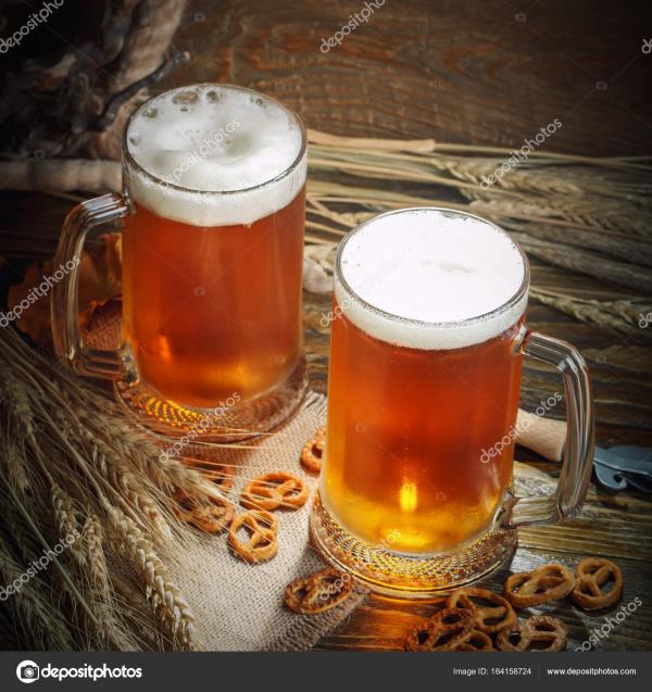 Glass of fresh beer on the table