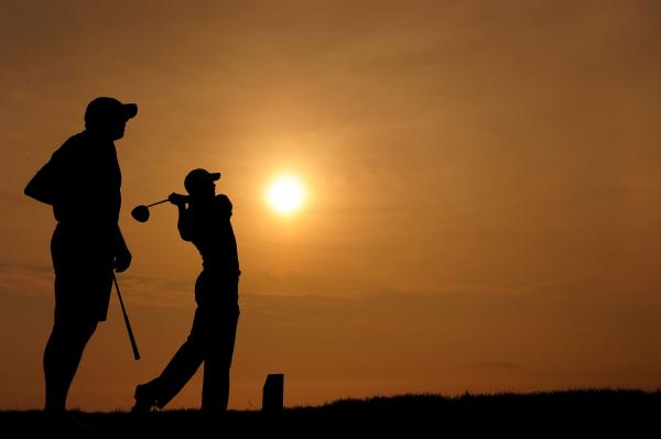 Golfer at sunset