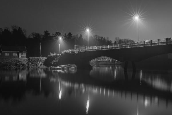 Grayscale Photo of Bridge at Night
