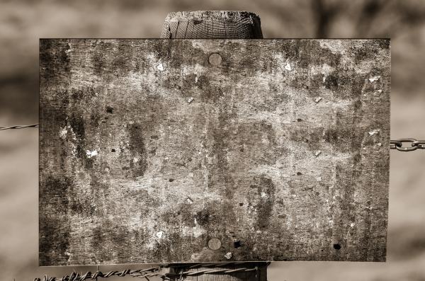 Grayscale Photography of Brown Wooden Board on Fence