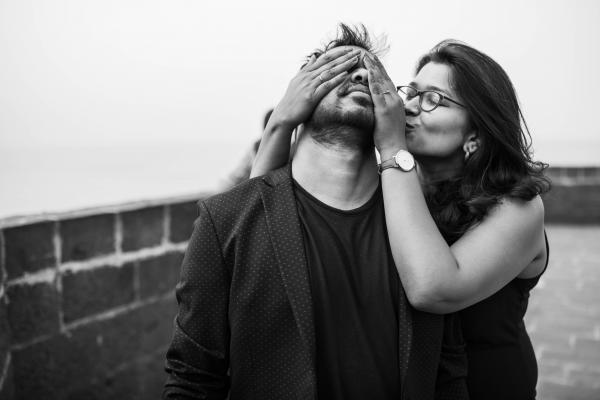 Grayscale Photography of Woman Covering Eyes of Man