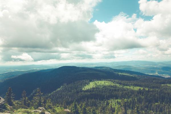 Green Hills Below White Cloudy Sky