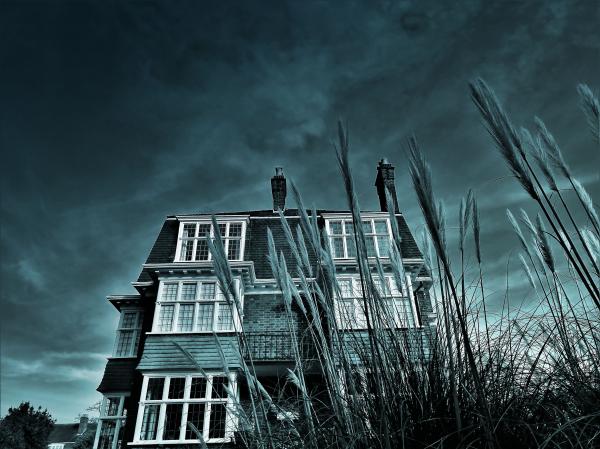 Greyscale House Photo Under Clouds