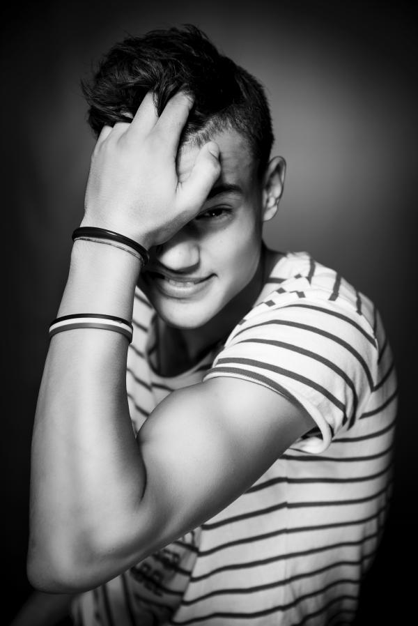 Greyscale Photo of Man in Striped Shirt