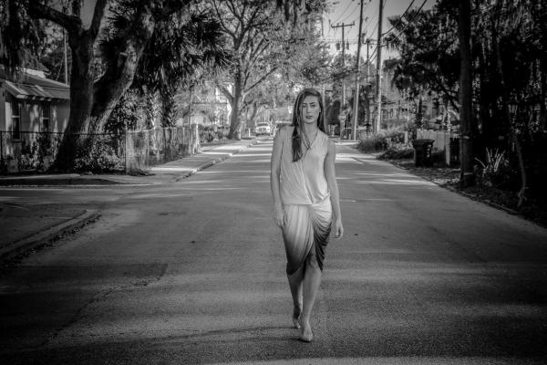 Greyscale Photo of Woman Standing on Street