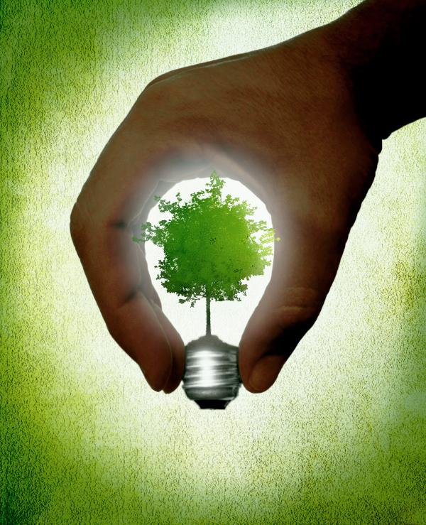 Hand creating a lightbulb