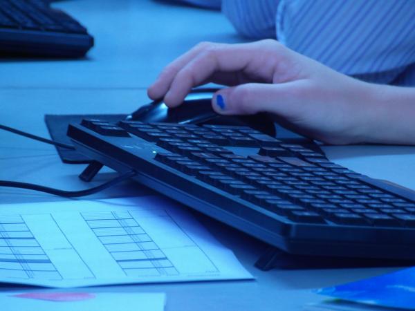 Hand on Computer Mouse