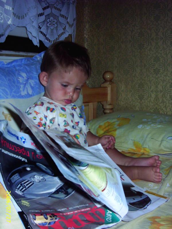 He is reading a magazine