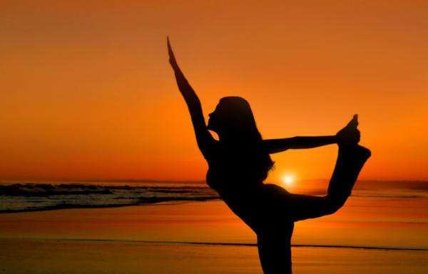 Healthy young woman practicing yoga
