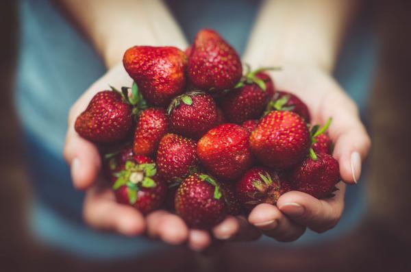 Holding a strawberry