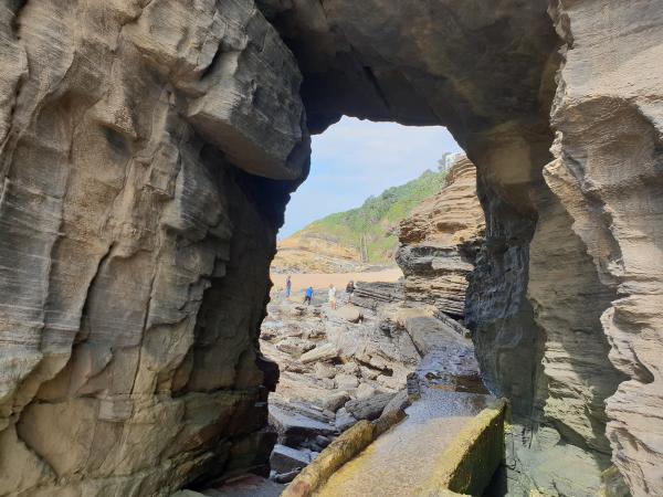 Hole in the rock behind the beach