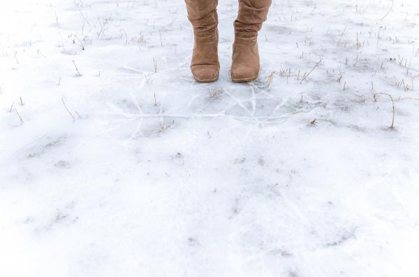 Human Standing on Frosted Ground