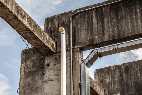 Industrial exhaust and conduits on pillar