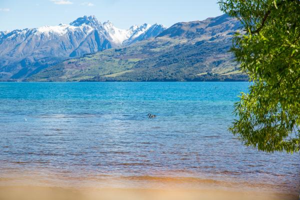Landscape Photo of Body of Water With Mountain As Background