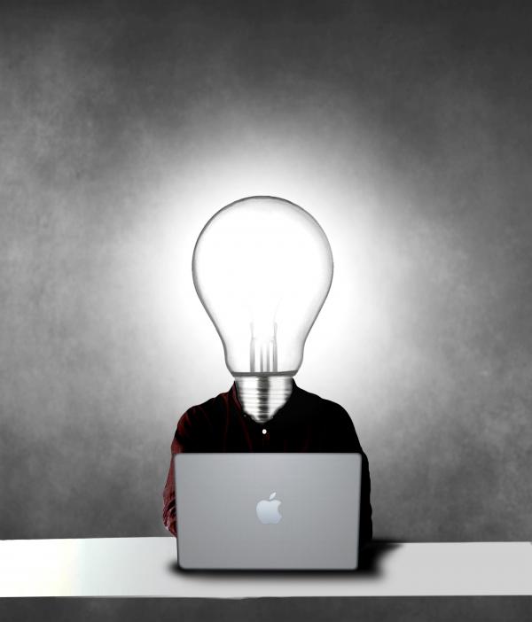 Lightbulb headed man being creative