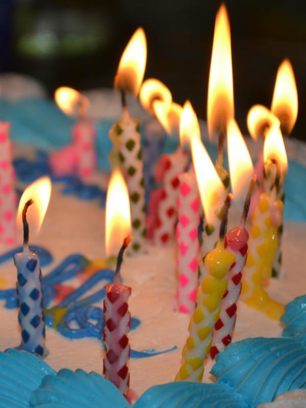 Lit Candles on Birthday Cake