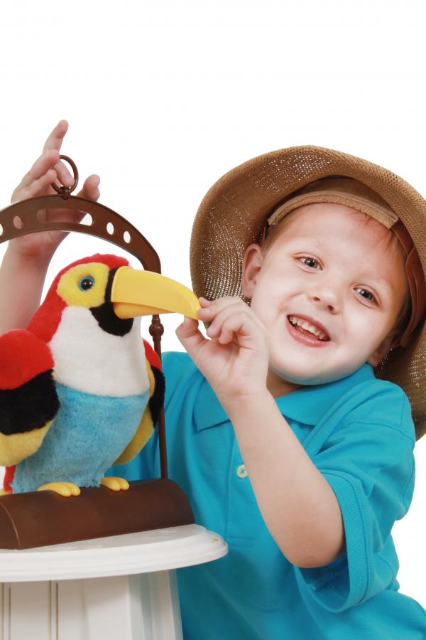 Little boy talks to a bird