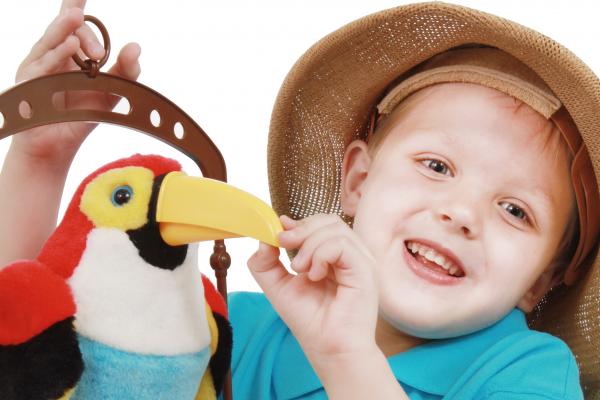 Little boy talks to a bird